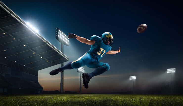 Giocatore di football americano di football americano nello stadio di sport professionistico