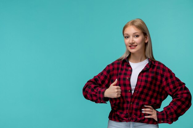 Giornata internazionale degli studenti bella ragazza carina in camicia rossa a quadri che mostra un buon gesto