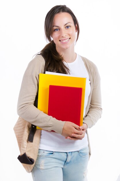 Giovane studente con i suoi libri su sfondo bianco