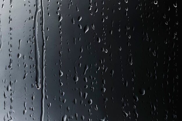 Gocce di pioggia su priorità bassa strutturata di vetro