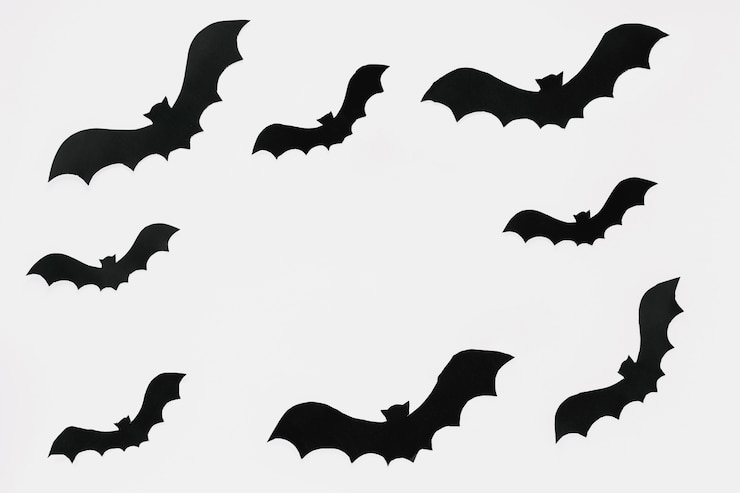 Foto gratuito i pipistrelli scuri hanno tagliato la carta