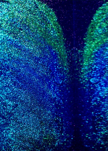 Il bokeh blu e verde di scintillio illumina la priorità bassa