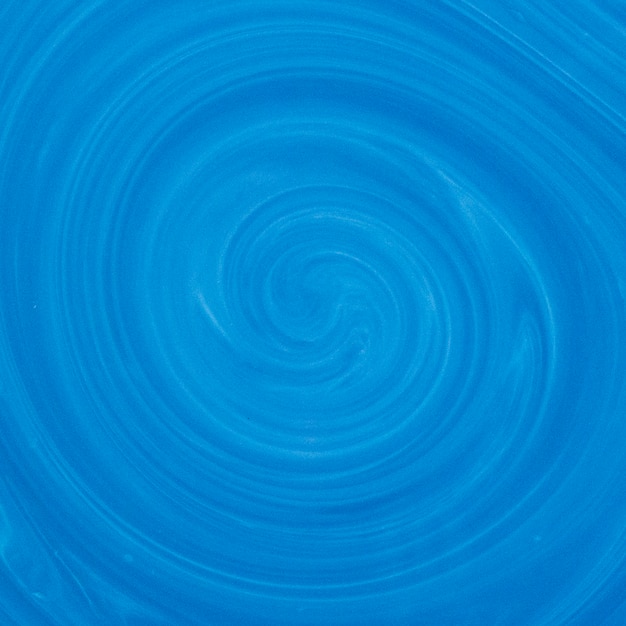 Il colore blu e bianco del turbinio mescola il contesto fluido di arte