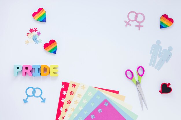 Iscrizione di orgoglio con icone omosessuali coppie e cuori arcobaleno