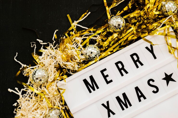 Foto gratuito iscrizione merry xmas a bordo con paillettes