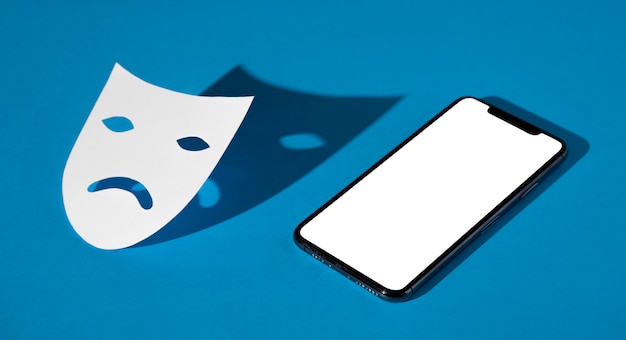 Lunedì blu con maschera triste e smartphone