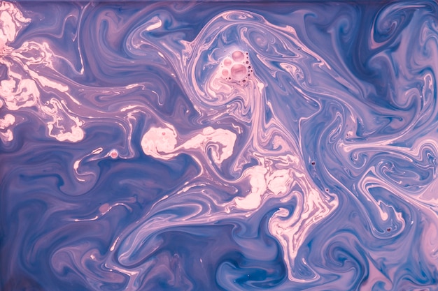 Macchie di vernice colorata sullo sfondo di arte liquida
