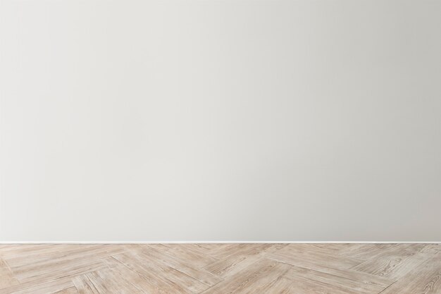 Modello di muro di cemento bianco grigio con un pavimento in legno