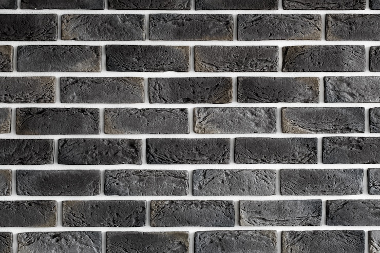 Foto gratuito muro di mattoni marrone scuro