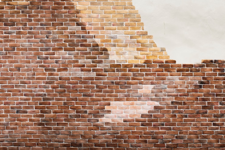 Foto gratuito muro di mattoni marrone