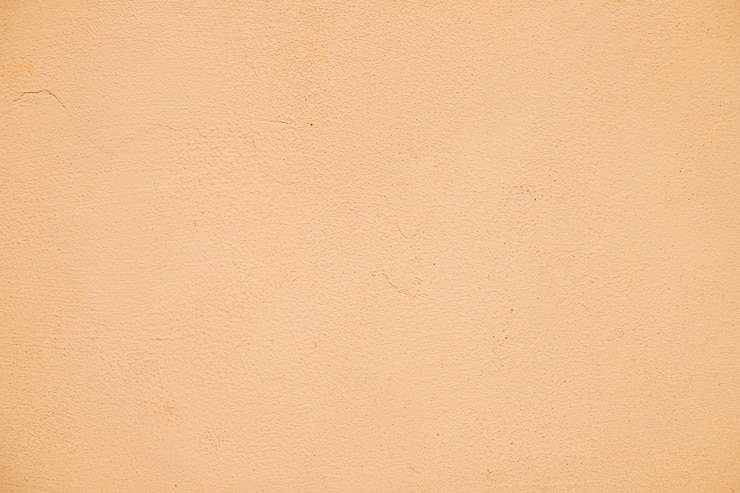 Foto gratuito parete strutturata verniciata arancione vuota