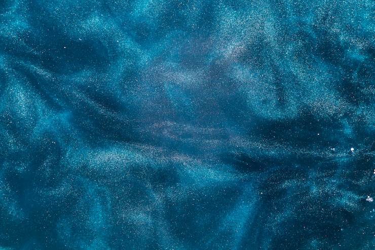 Foto gratuito particelle di pinta che turbinano nell&#39;acqua
