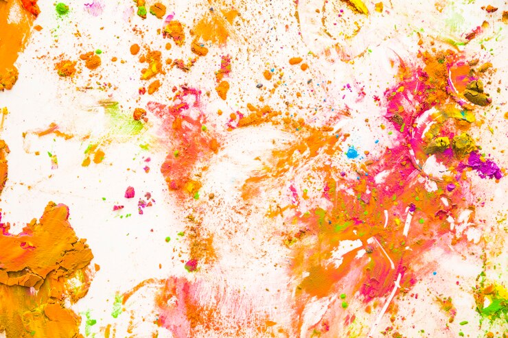 Foto gratuito particelle di polvere di colore schizzato su sfondo bianco