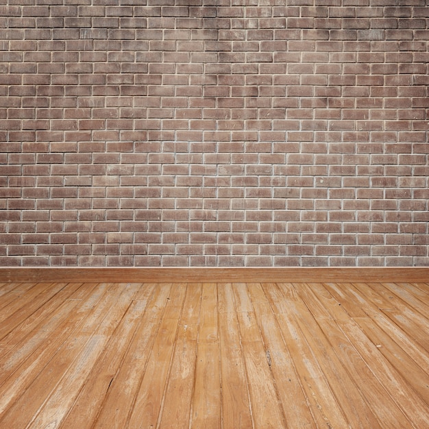 pavimento in legno con il muro di mattoni