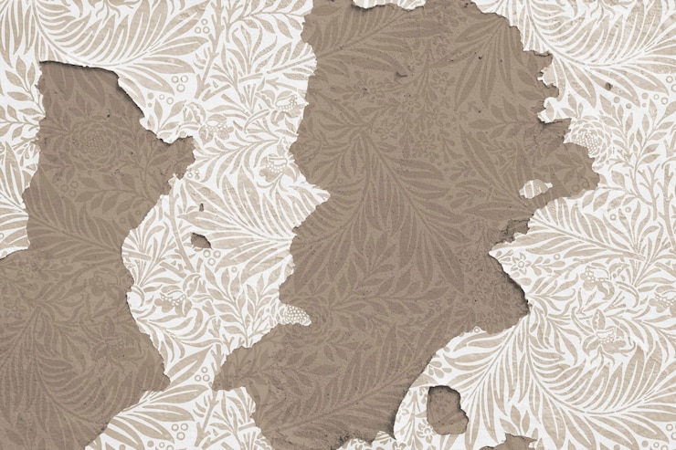 Foto gratuito peeling carta da parati floreale sul muro di cemento