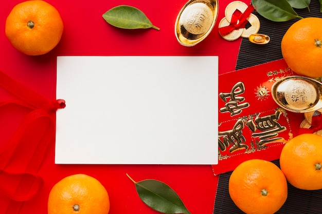Piatto lay capodanno cinese 2021 arance e copia spazio carta