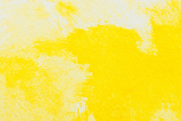 Pittura ad acquerello astratta gialla testurizzati su sfondo bianco della carta