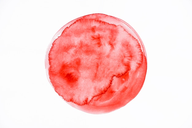 Pittura astratta di colore rosso su carta bianca