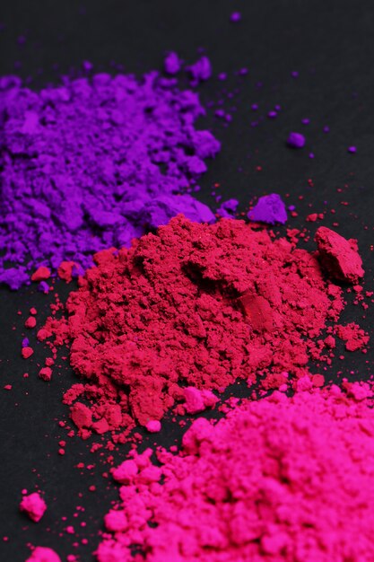 Polvere rosa, viola e rossa, concetto di festival di Holi