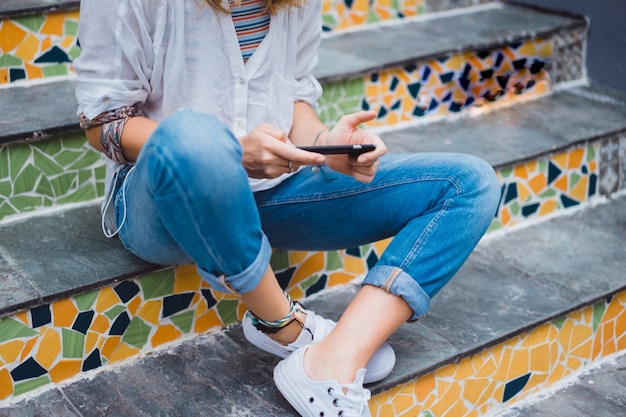 Pretty Young woman using smartphone