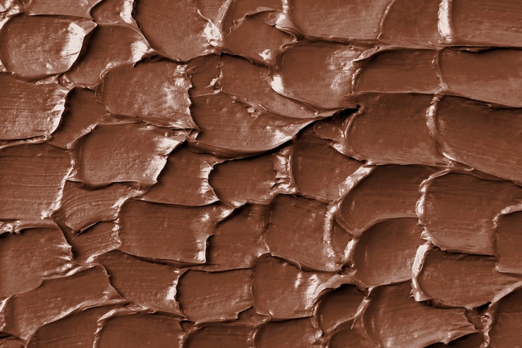 Foto gratuito primo piano del fondo di struttura della glassa del cioccolato