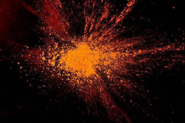 Primo piano della priorità bassa arancione astratta della vernice della polvere