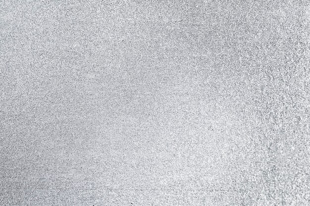 Primo piano di sfondo con texture glitter grigio