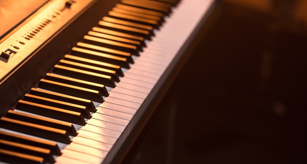 Primo piano di tasti di pianoforte, su un bellissimo sfondo colorato, il concetto di strumenti musicali