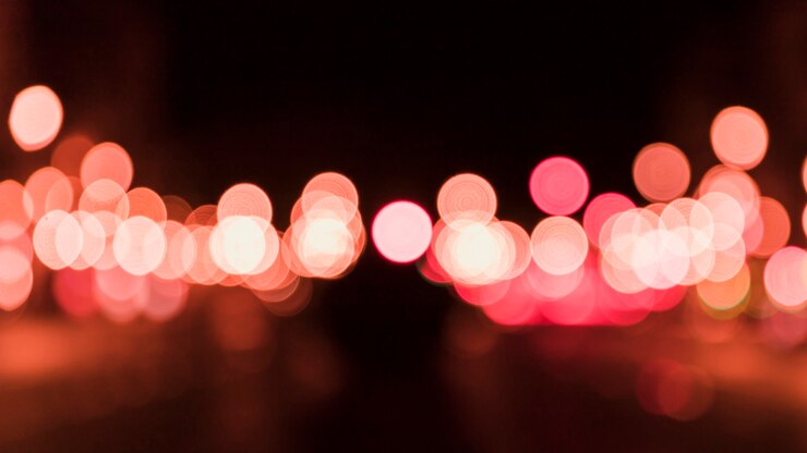 Foto gratuito priorità bassa circolare astratta del bokeh alla notte