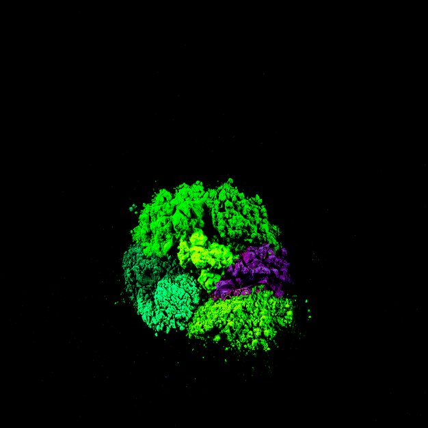Punto di polvere verde e blu su sfondo nero