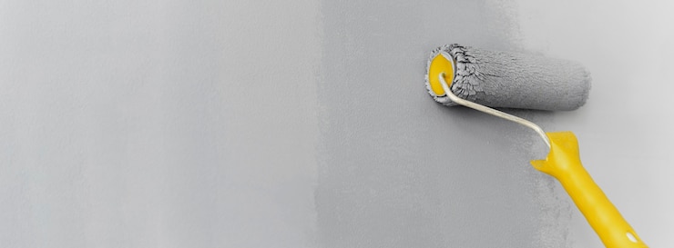 Foto gratuito rullo pittura muro grigio