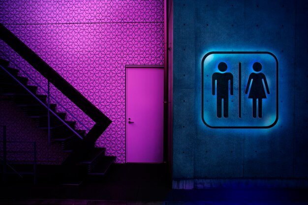 Segno di bagno luminoso al neon di notte