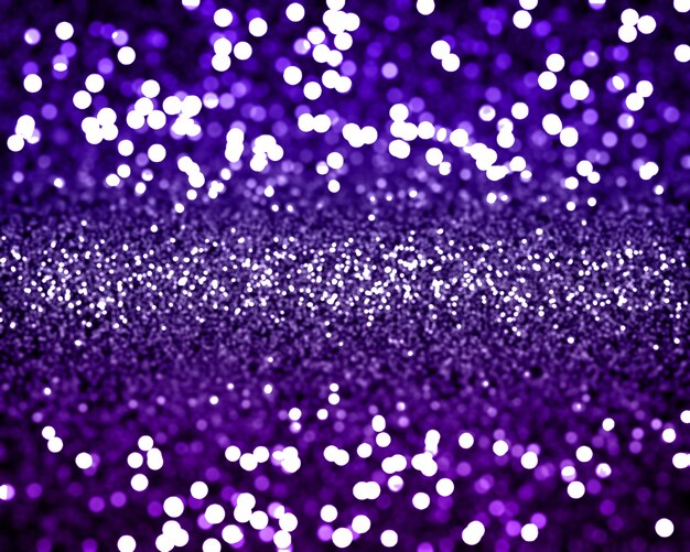 Sfondo di Natale con glitter viola e luci bokeh