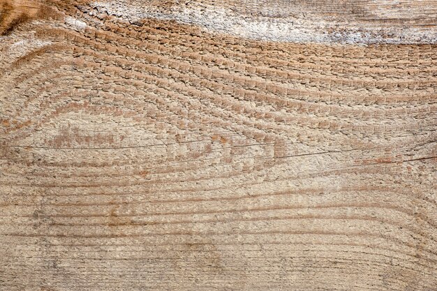 Sfondo in legno con linee orizzontali e nodo a forma di occhio