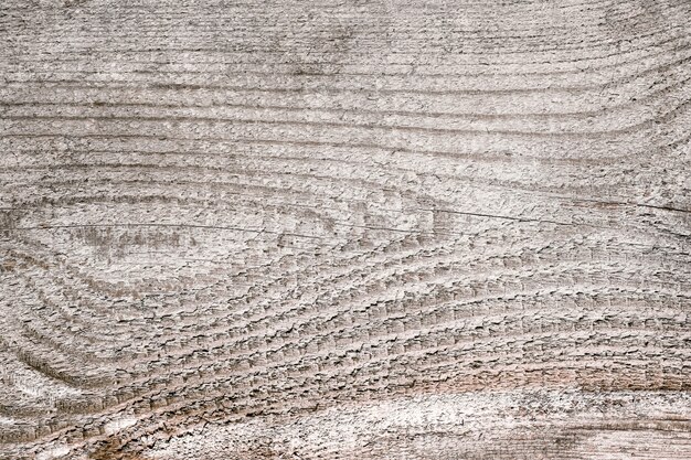 Sfondo in legno con linee orizzontali e nodo a forma di occhio