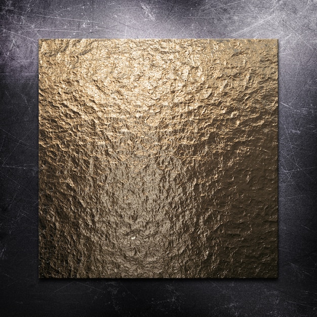 Sfondo metallico graffiato con piastra metallica oro