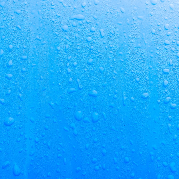 Struttura blu con gocce d&#39;acqua