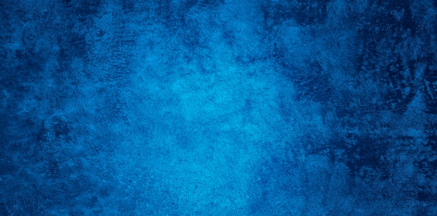 Struttura della parete dello stucco blu navy sollievo decorativo grunge astratto. Sfondo colorato ruvido grandangolare