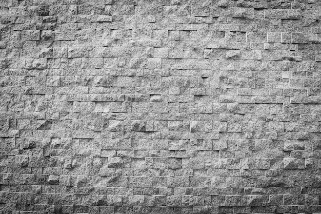 Struttura e superficie del mattone di pietra di colore grigio e nero per fondo