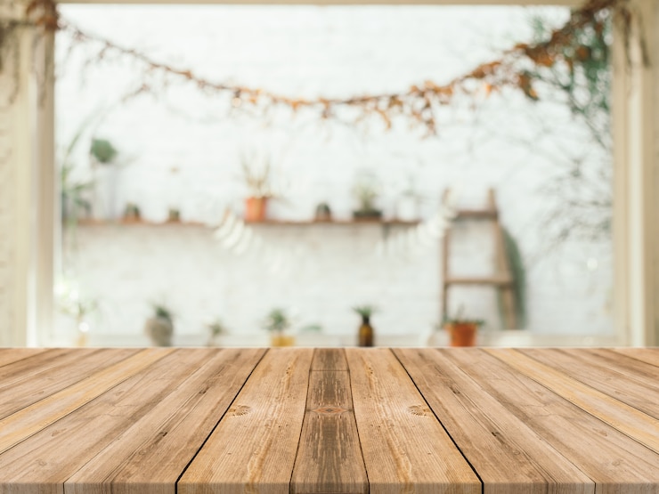 Foto gratuito tavolo in legno con sfondo sfocato