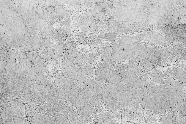 Texture di un muro di cemento grigio con crepe ricci