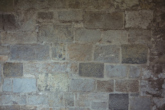 Vecchio muro di pietra di sfondo
