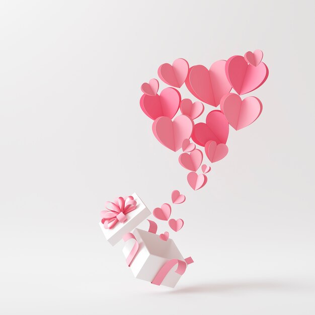 Vista anteriore di un sacco di cuori rosa che escono da una scatola di regali