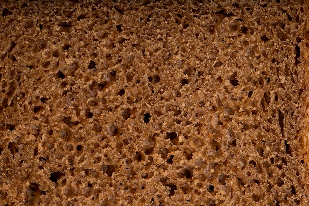 Vista del primo piano di struttura del pane di segale per gli usi del fondo