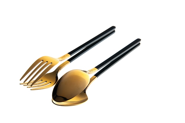 vista frontale posate d'oro cucchiaio e forchetta su sfondo bianco
