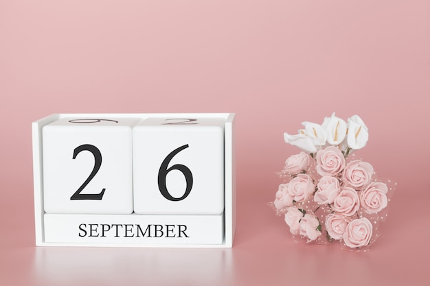 26 settembre. Giorno 26 del mese. Cubo calendario su sfondo rosa moderno, concetto di bussines e un evento importante.
