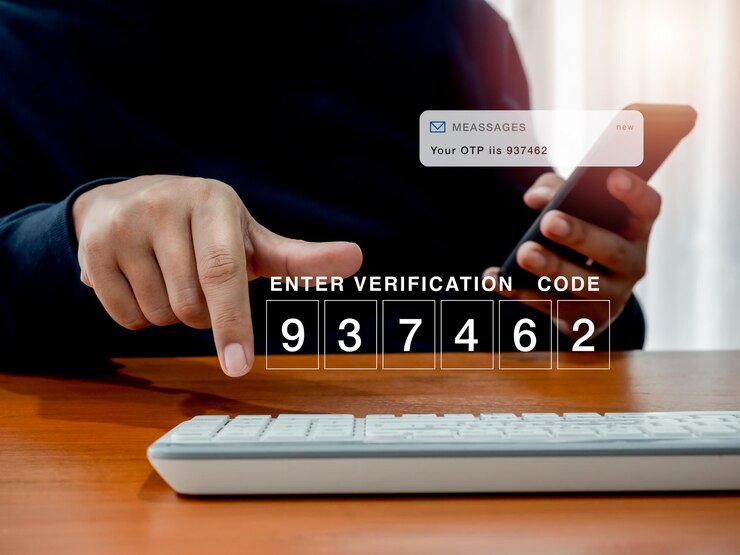 Photo 2fa or two factor authentication cyber security concept password code number for enter verification code showing on computer while man hold smartphone and got sms with otp passcode for security