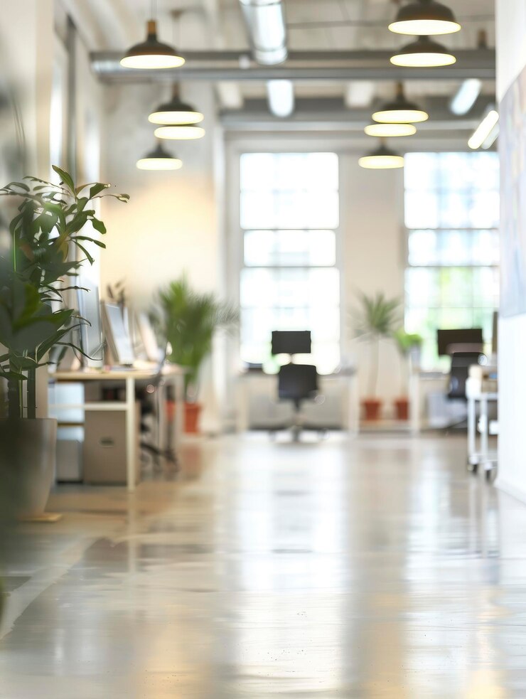 A blurry photo of a modern bright office space with no people in it