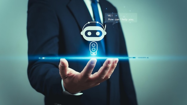 A businessman uses his hand to display a hologram of a robot or intelligent AI program showing