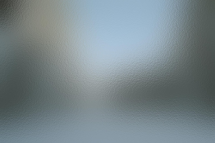 Photo a close up of a shiny surface with a blue background
